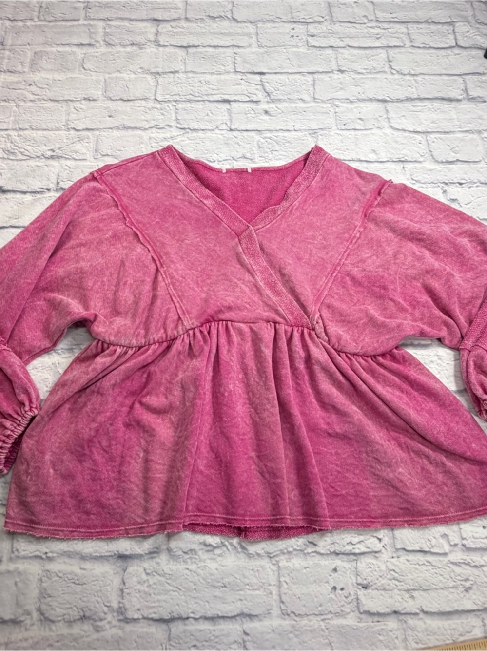Boutique  Pink Washed V-Neck Peplum Top. Long Sleeves. Size S.